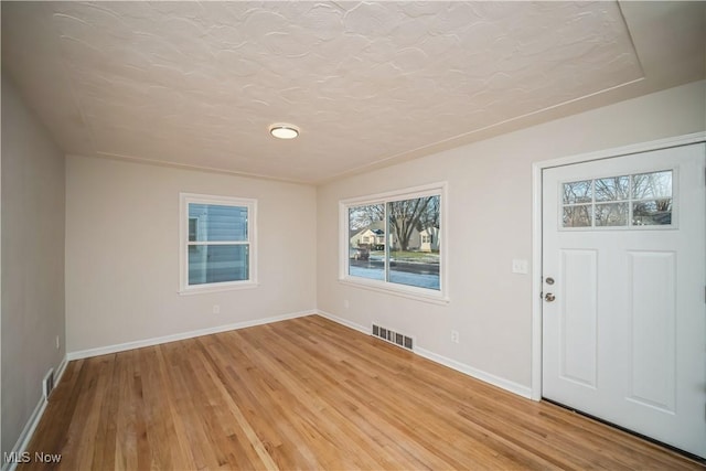 foyer with light wood-type flooring