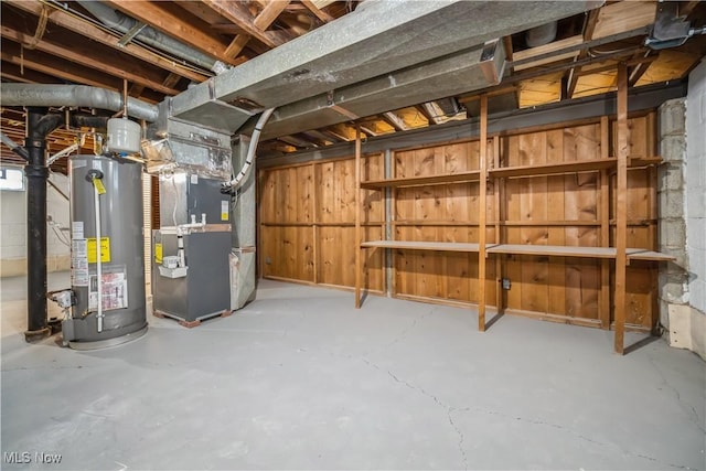 basement with gas water heater and heating unit