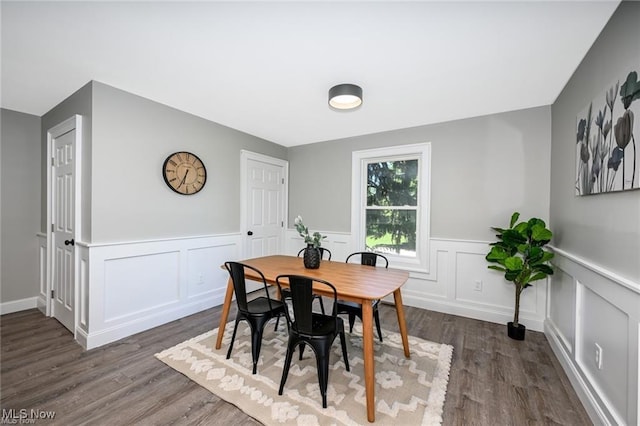 dining room with dark hardwood / wood-style floors