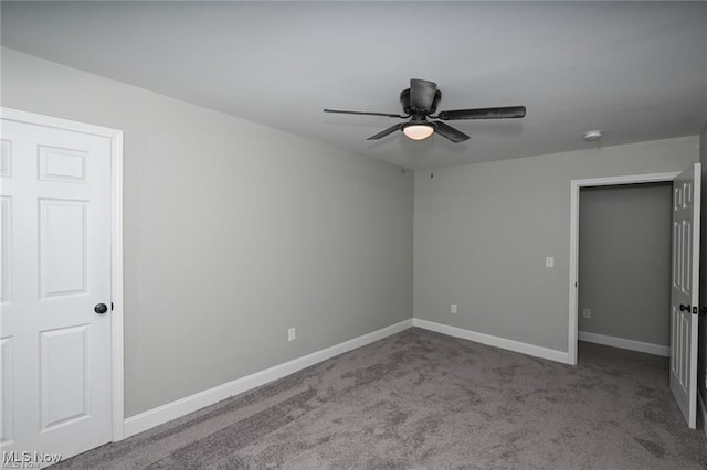 unfurnished bedroom with ceiling fan and carpet floors