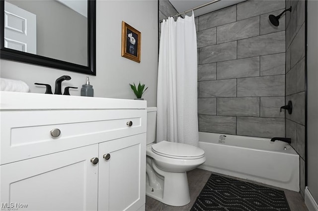 full bathroom with vanity, wood-type flooring, shower / tub combo, and toilet