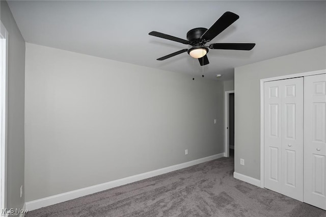 unfurnished bedroom with ceiling fan, light carpet, and a closet