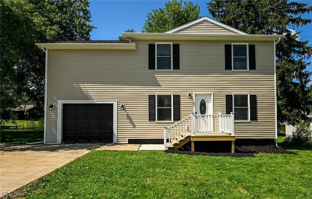 view of front of property featuring a front lawn and a garage