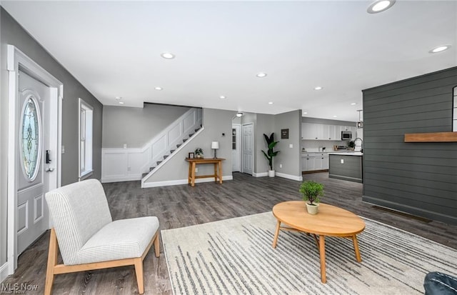 living room with sink and hardwood / wood-style flooring