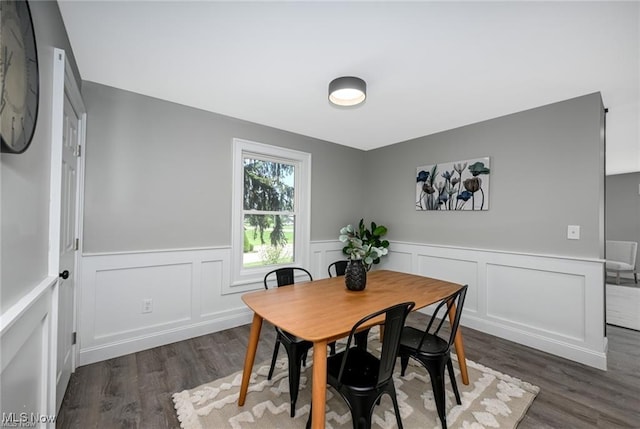 dining room with dark wood-type flooring