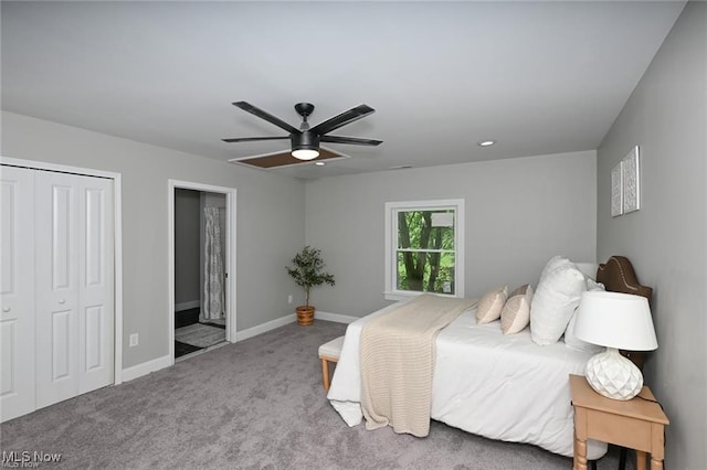 bedroom with carpet flooring, connected bathroom, and ceiling fan