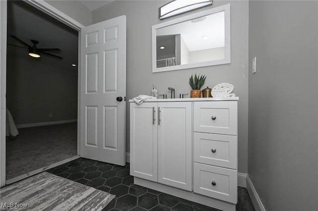 bathroom featuring ceiling fan, tile patterned flooring, and vanity