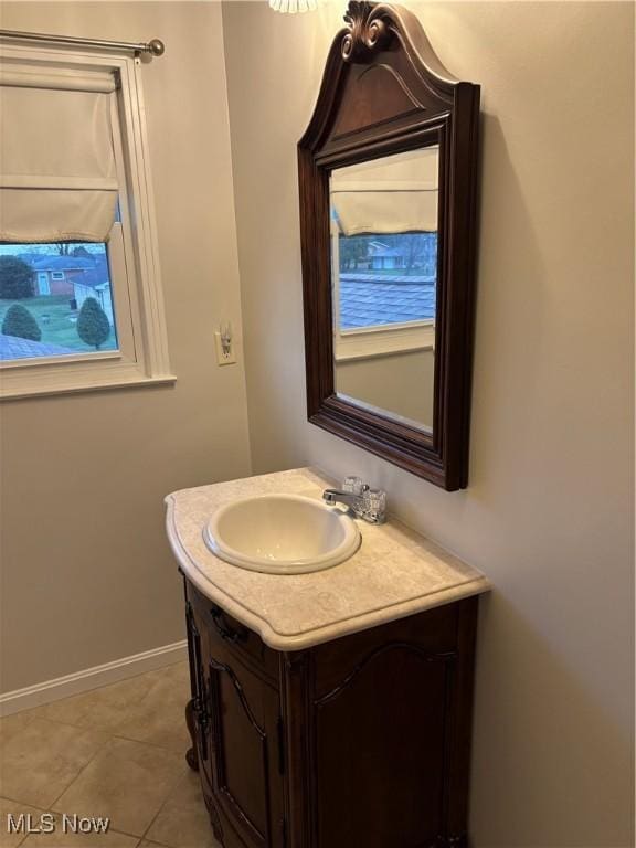 bathroom featuring tile patterned floors and vanity