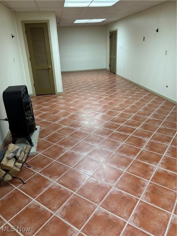 basement featuring a drop ceiling