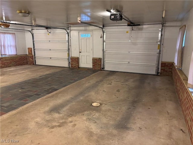 garage featuring a garage door opener