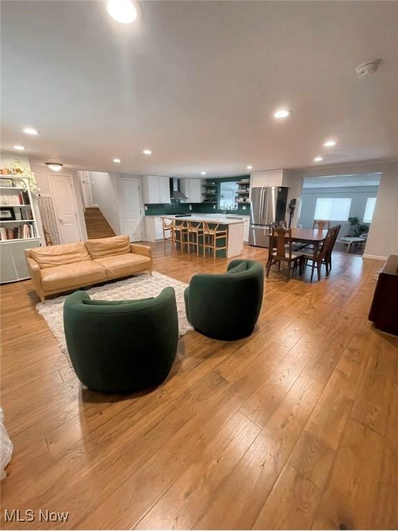 living room with light hardwood / wood-style flooring