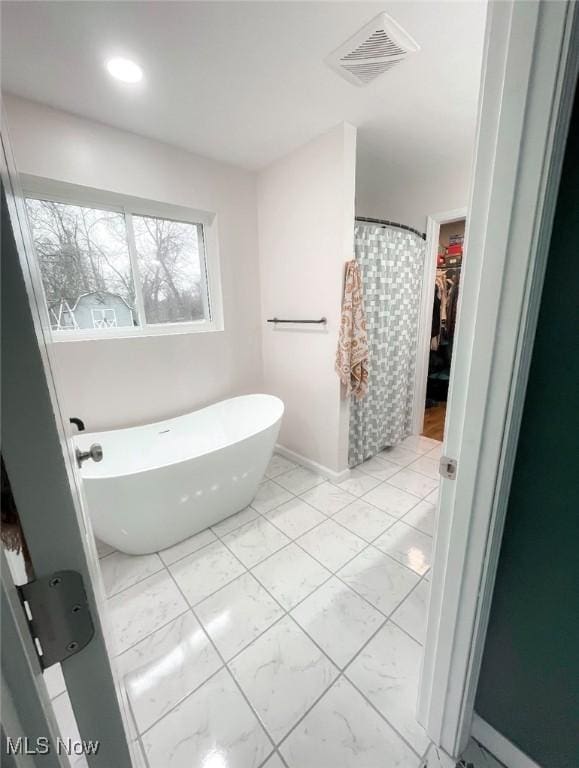 bathroom with plus walk in shower