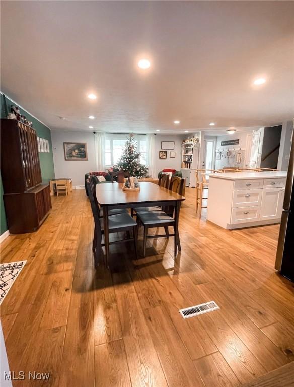 dining area with light wood-type flooring