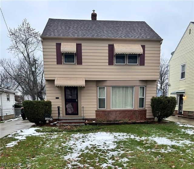 view of front of house with a yard