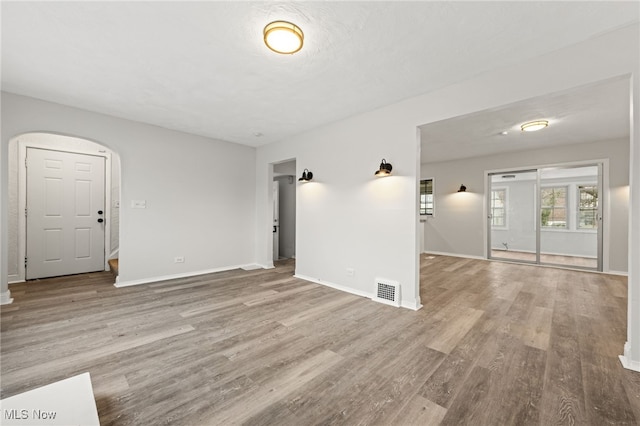 empty room with hardwood / wood-style flooring