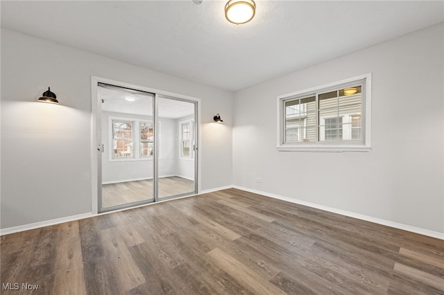 unfurnished bedroom with wood-type flooring and a closet