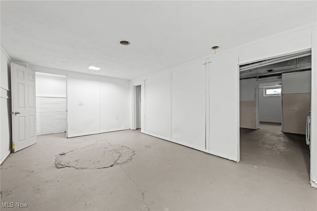 unfurnished bedroom with concrete floors