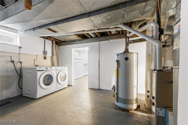 basement with separate washer and dryer and water heater