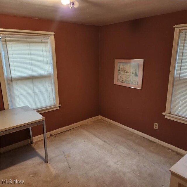 carpeted spare room with a wealth of natural light