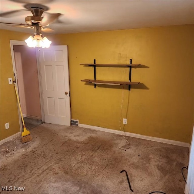 spare room with carpet flooring and ceiling fan