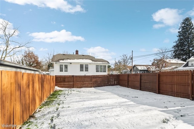 view of snow covered property