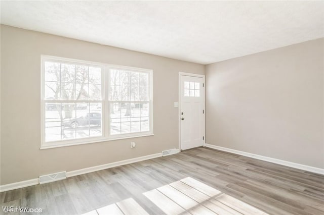 foyer entrance featuring light hardwood / wood-style floors