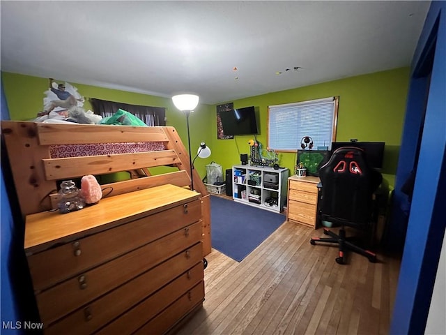 bedroom featuring hardwood / wood-style floors