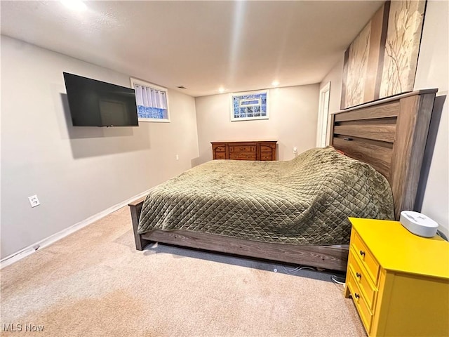 bedroom featuring light carpet