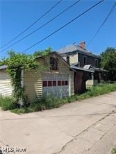 view of property exterior featuring a garage