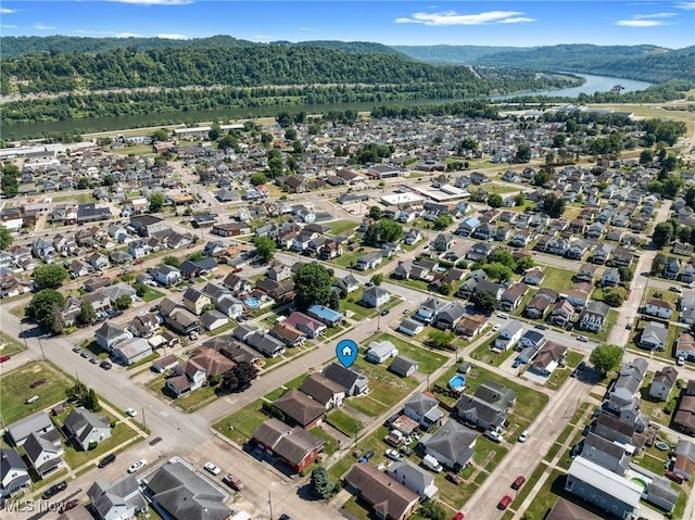 aerial view featuring a water and mountain view