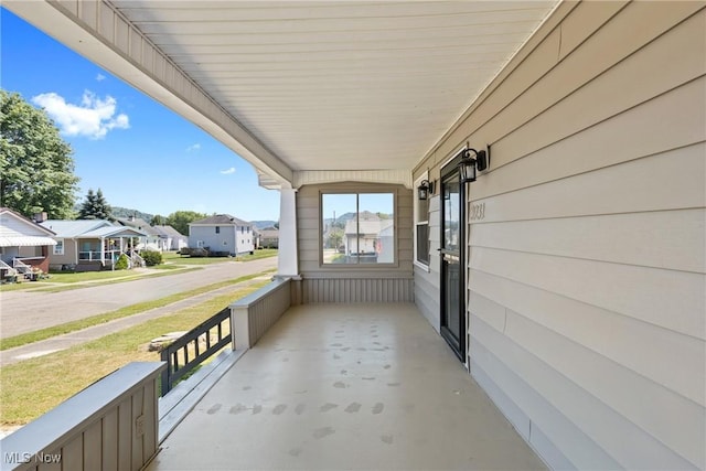 balcony featuring covered porch