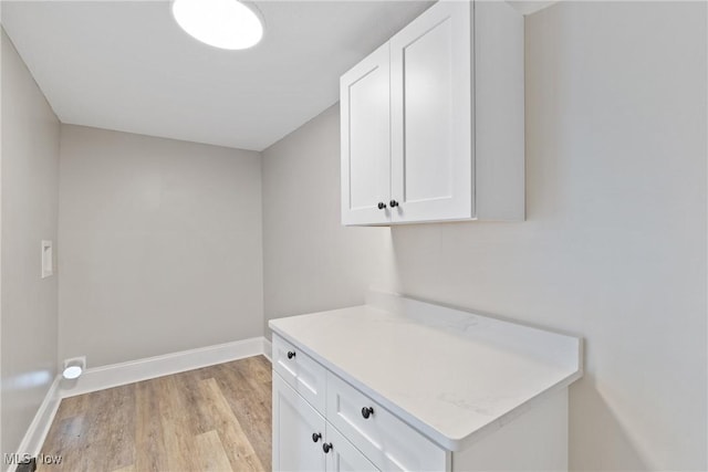 laundry room featuring light hardwood / wood-style flooring