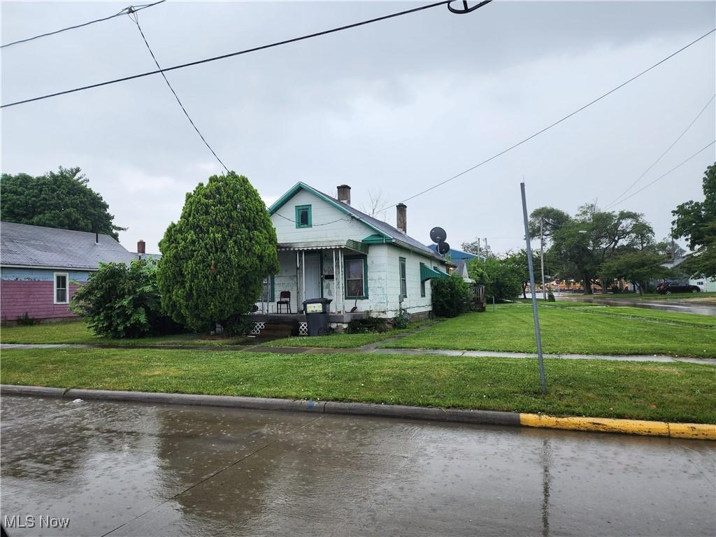 bungalow with a front lawn