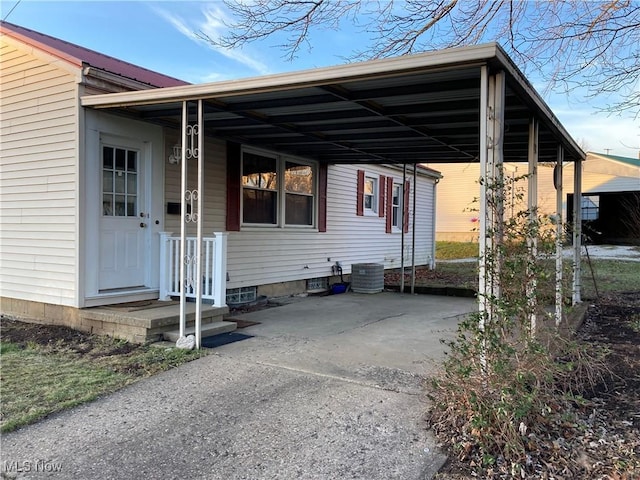 exterior space featuring a carport and central air condition unit