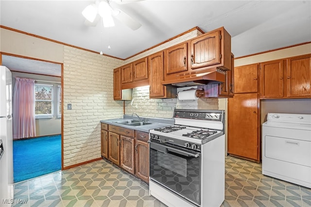 kitchen featuring ceiling fan, sink, premium range hood, washer / clothes dryer, and white appliances