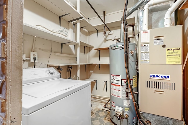 clothes washing area with washer / dryer, gas water heater, and heating unit