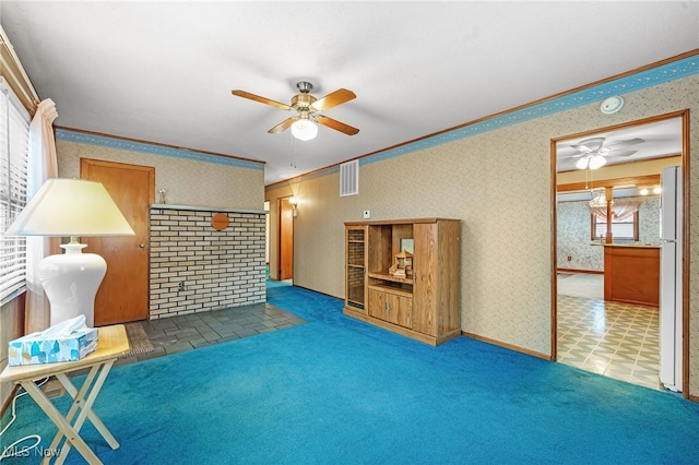 living area with a fireplace, carpet floors, plenty of natural light, and crown molding