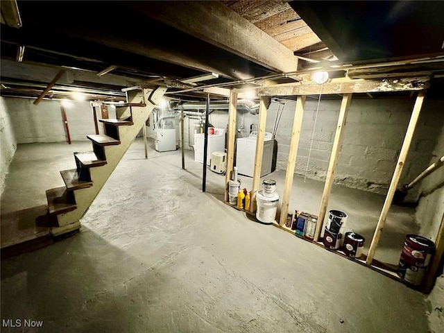 basement with washer and clothes dryer