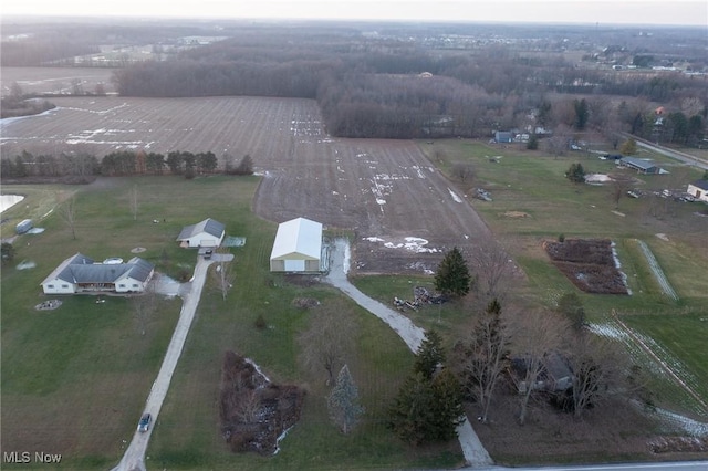 birds eye view of property with a rural view