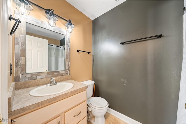 bathroom featuring tile patterned flooring, vanity, toilet, and curtained shower