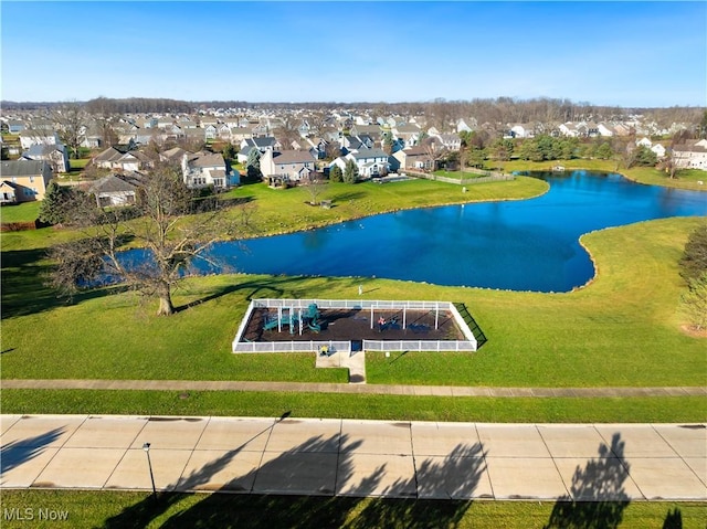 surrounding community featuring a water view