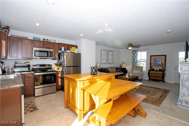 kitchen with stainless steel appliances and ceiling fan