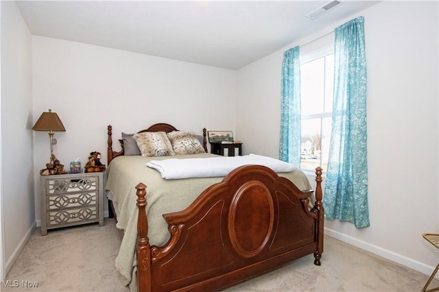 bedroom with light colored carpet