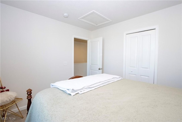 carpeted bedroom featuring a closet