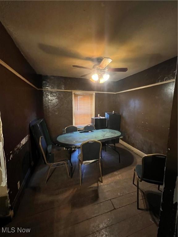 dining space featuring hardwood / wood-style flooring and ceiling fan