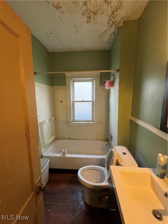 full bathroom featuring vanity, toilet, and bathtub / shower combination