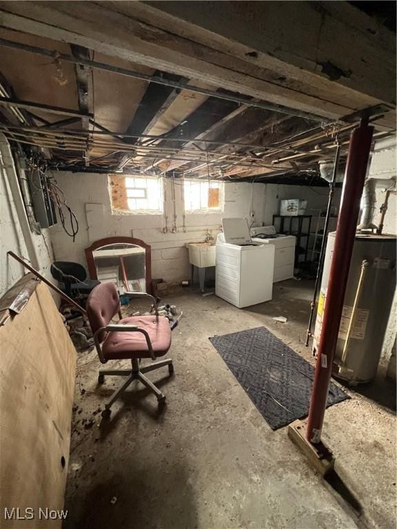 basement with independent washer and dryer, sink, and water heater