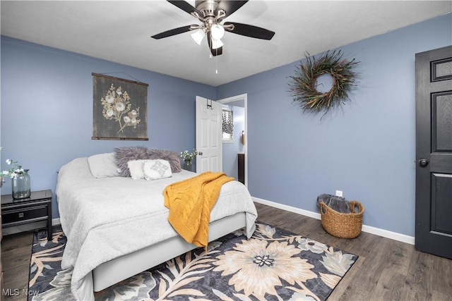 bedroom featuring ceiling fan and dark wood-type flooring