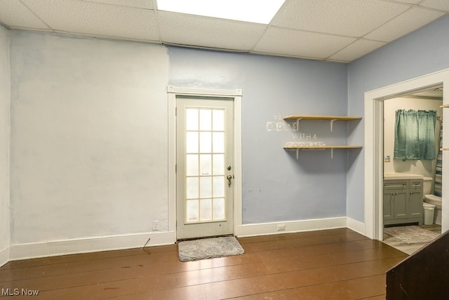 entryway with a paneled ceiling and hardwood / wood-style floors