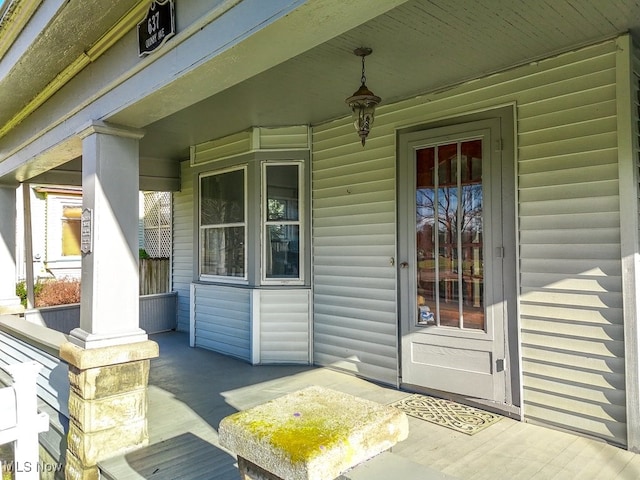 property entrance featuring covered porch